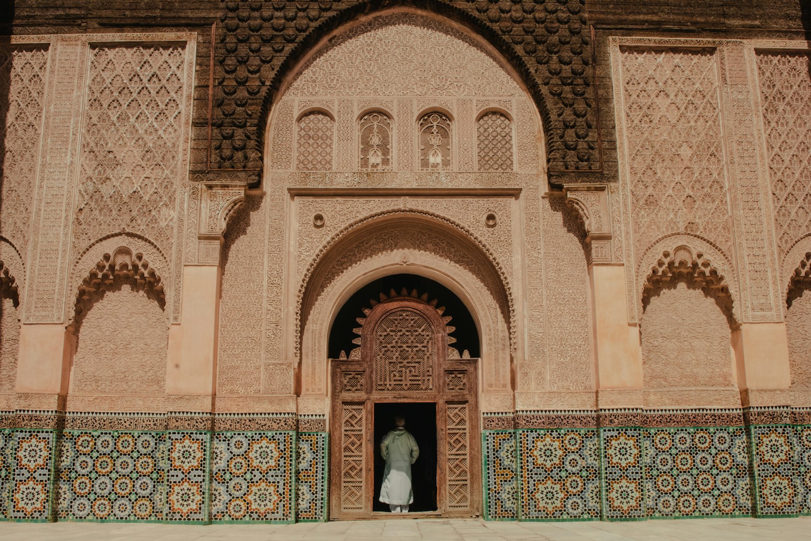 Ultimate Morocco Travel Guide 8 person standing on opened door of building,morocco travel guide