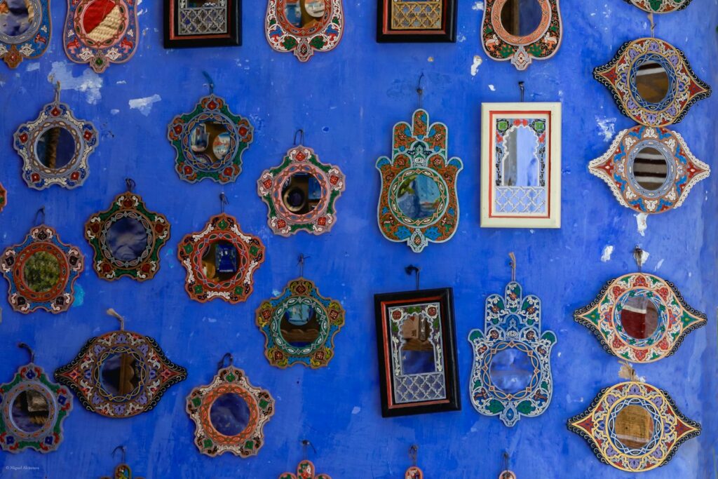 A blue wall with a bunch of pictures on it