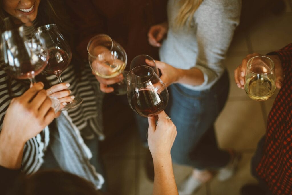 group of people tossing wine glass,wine morocco