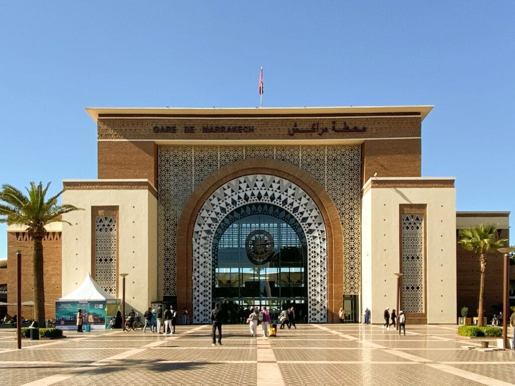 a large building with a clock on the front of it, marrakech casablanca distance