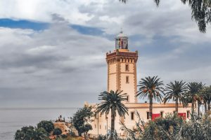a tall tower with a clock on top of it, DAY TOURs FROM FES