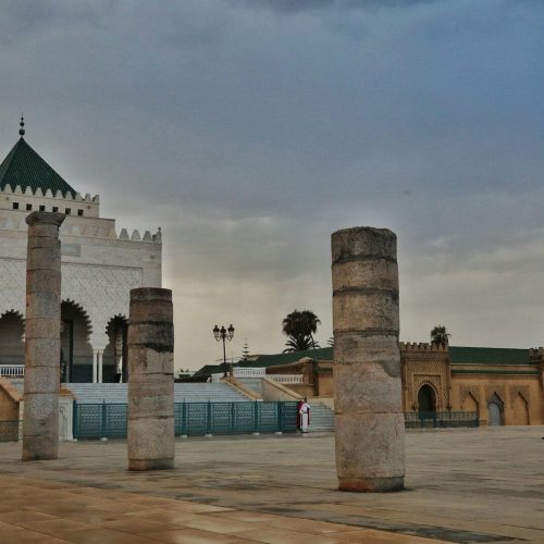 brown concrete building under gray sky