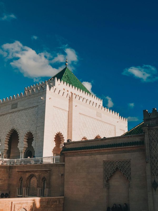 Majestic view of the Mausoleum of Mohammed V against a clear blue sky in Rabat, Morocco.