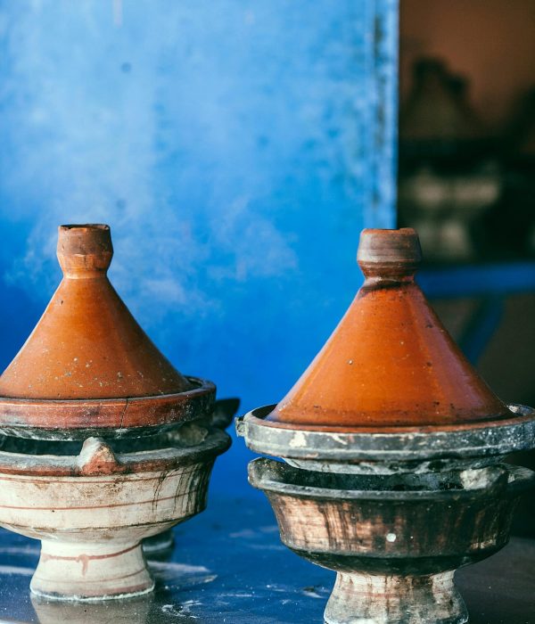 The Ultimate Guide to Moroccan Food: What to Eat in Morocco 2 Traditional Moroccan heat resistant tajines with cone shaped covers and circular base on table,moroccan food