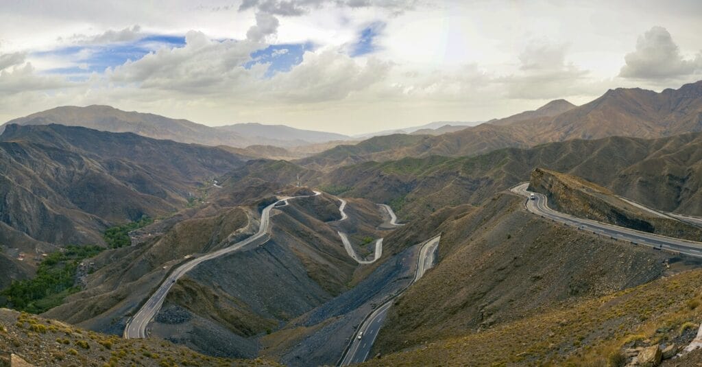 A view of a winding road in the mountains.Weather in Morocco in March