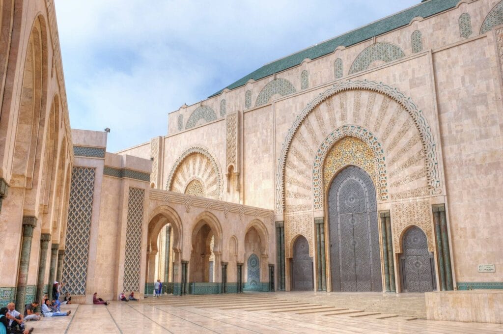 beige concrete building under blue sky during daytime.Weather in June in Morocco