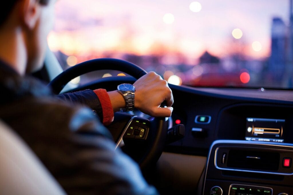 man driving a car wearing wrist watch.is there uber in morocco