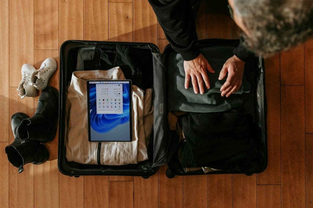 an overhead view of a person packing a suitcase.Weather in Morocco in July